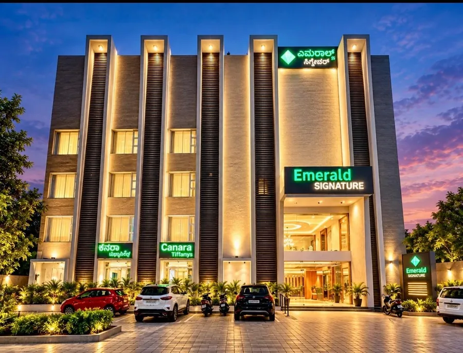 Emerald Signature exterior at dusk